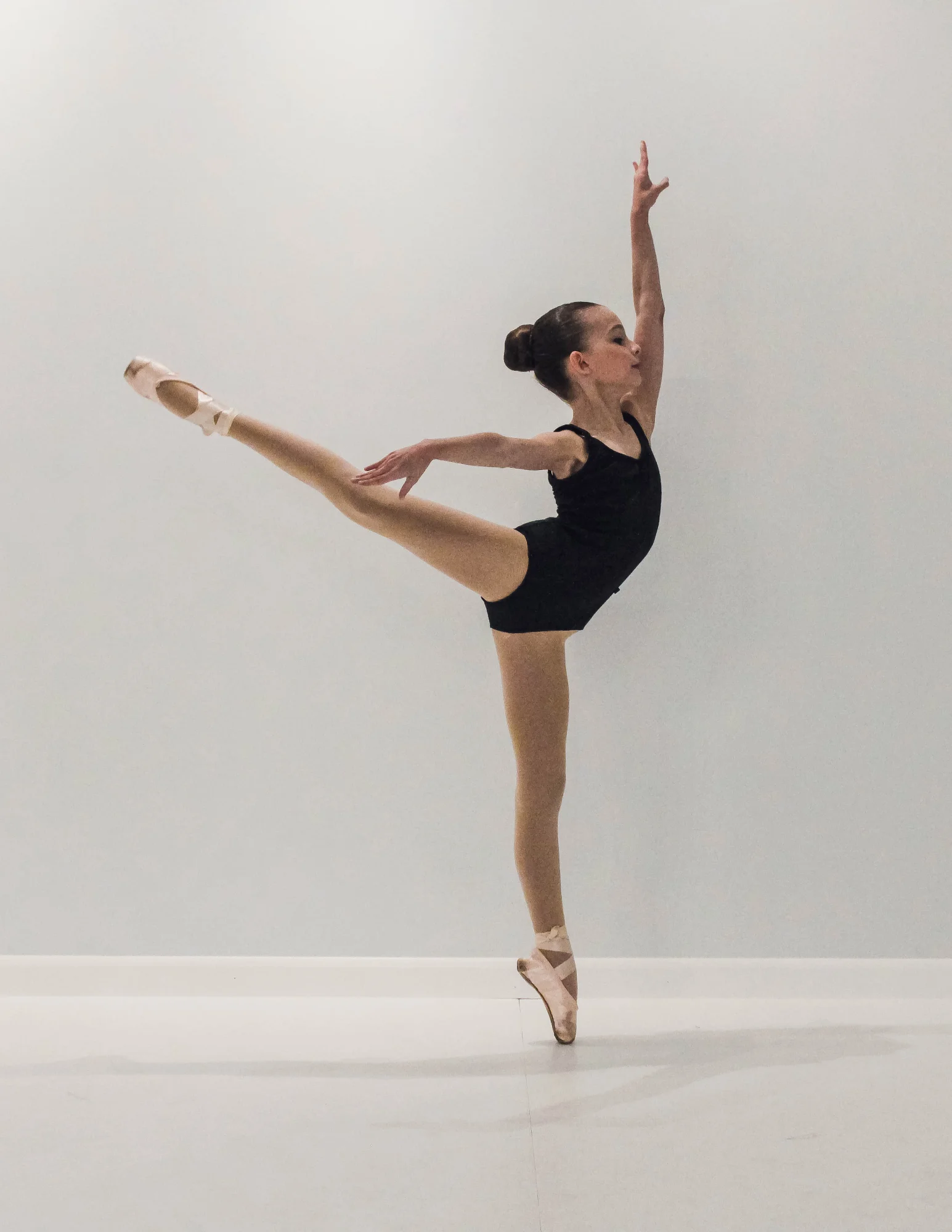 young-beautiful-modern-style-dancer-posing-on-a-studio-background-1